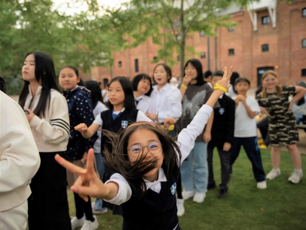 a group of people outside at The King's Summer School