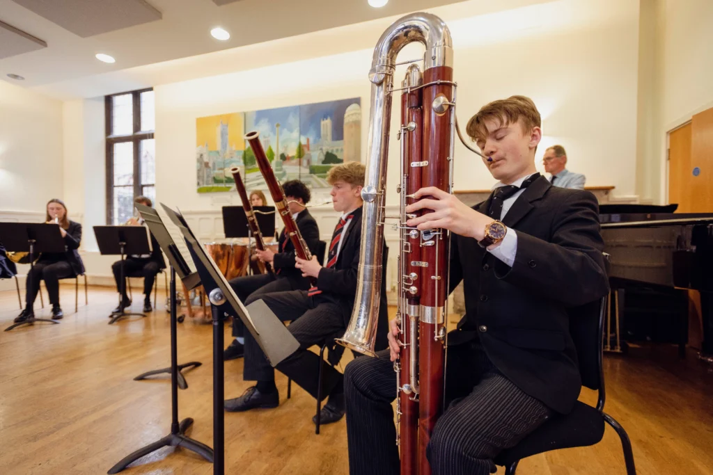 A group of students playing instruments at The King's Summer School's Music and Performance Academy